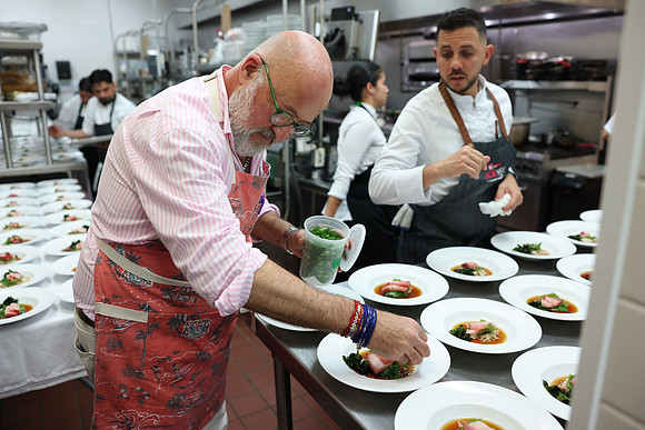 Andrew Zimmern & Jean Delgado cooking11