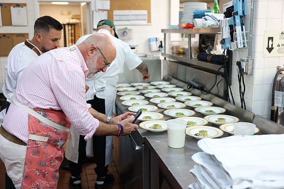 Andrew Zimmern & Jean Delgado cooking3